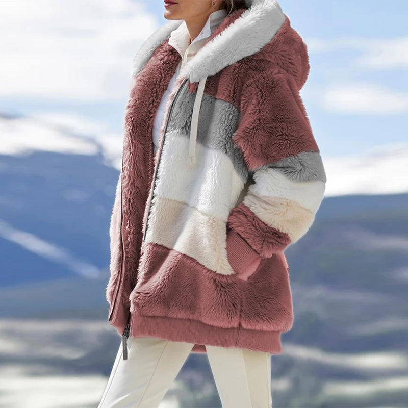 Woman wearing dusty rose colorblock fleece hooded jacket outdoors