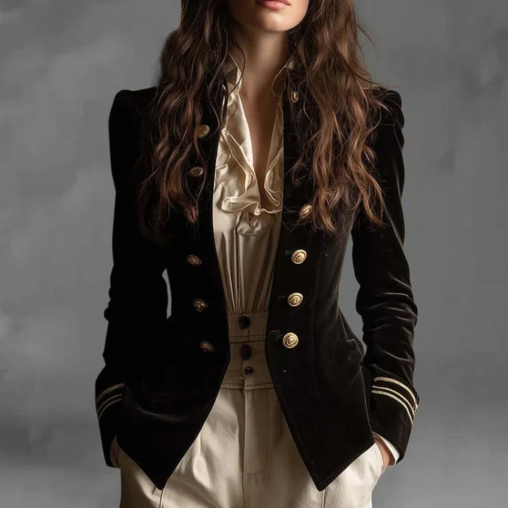 Woman wearing black velvet double breasted blazer with gold buttons