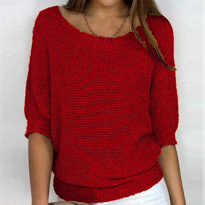 Red knit top with scoop neckline and three-quarter batwing sleeves