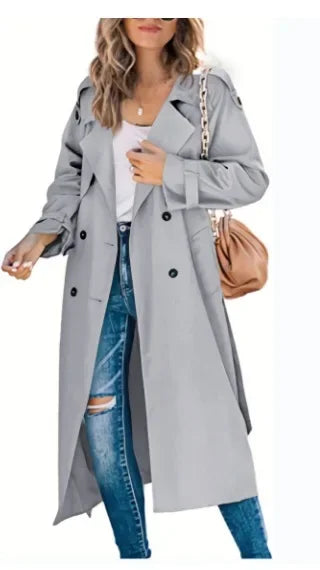 Woman wearing light gray double breasted trench coat