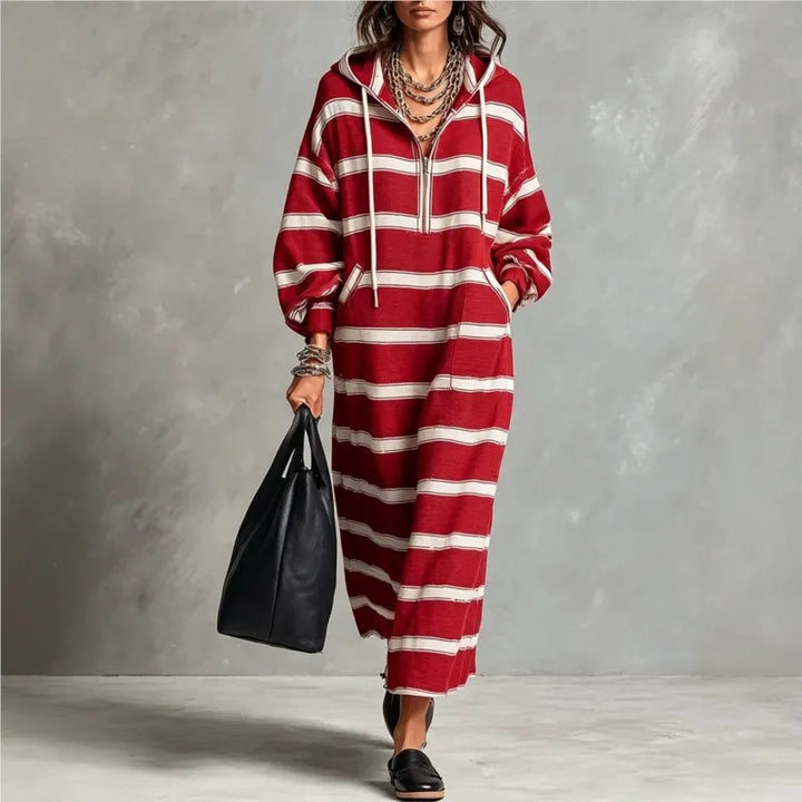 Woman walking in red and white striped half-zip hoodie maxi dress