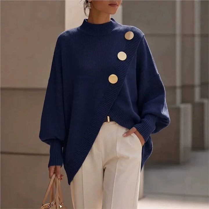 Woman wearing navy blue asymmetric hem sweater with gold buttons