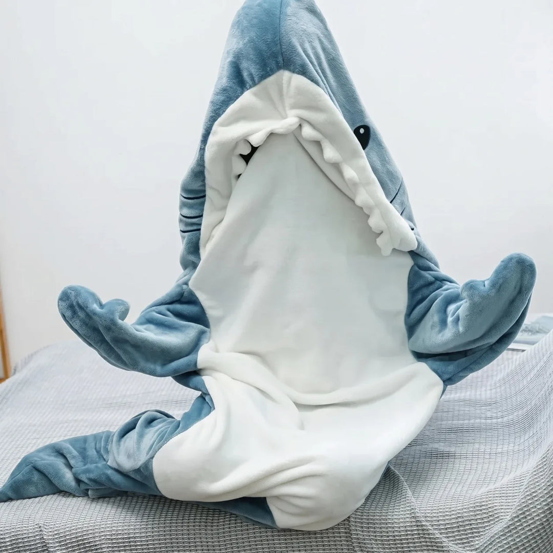 Blue shark wearable blanket laid flat showing hood and fins