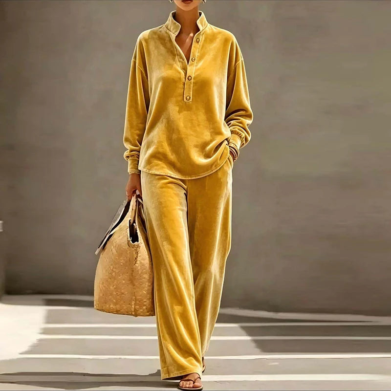 Woman wearing mustard yellow velvet stand collar top and wide leg pants set
