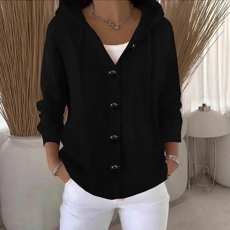 Woman wearing black hooded button-front cardigan sweater