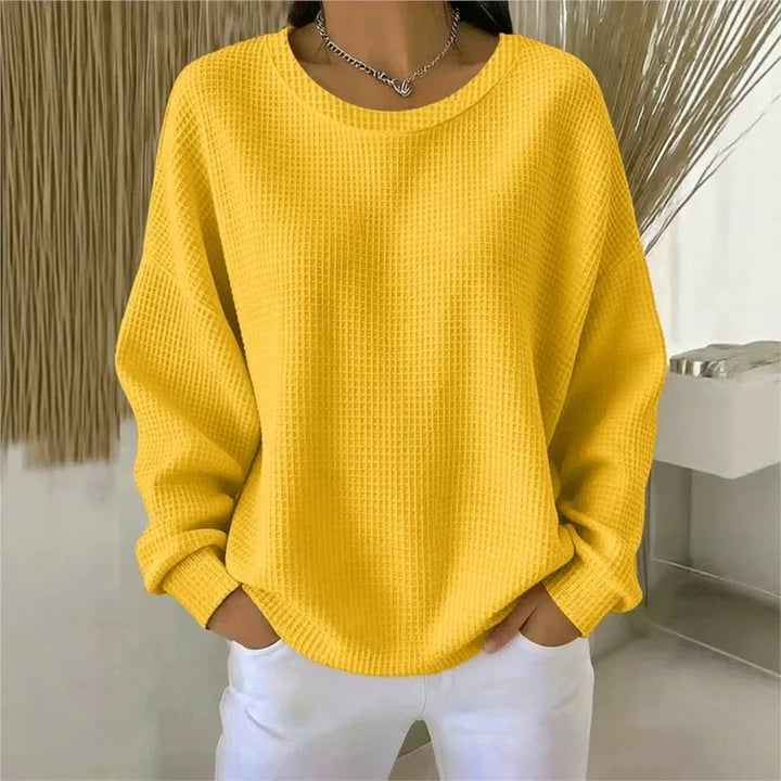 Woman wearing yellow waffle knit oversized top