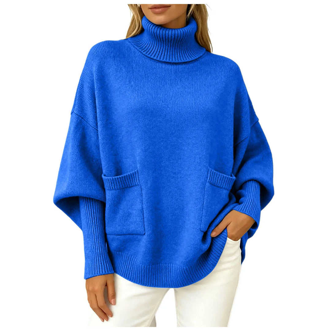 Woman wearing blue oversized turtleneck sweater with front pockets