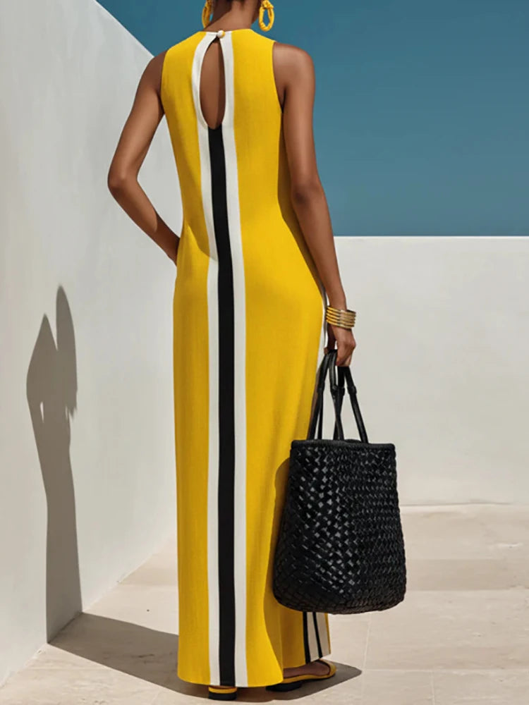 Back view of yellow striped maxi dress showing keyhole detail