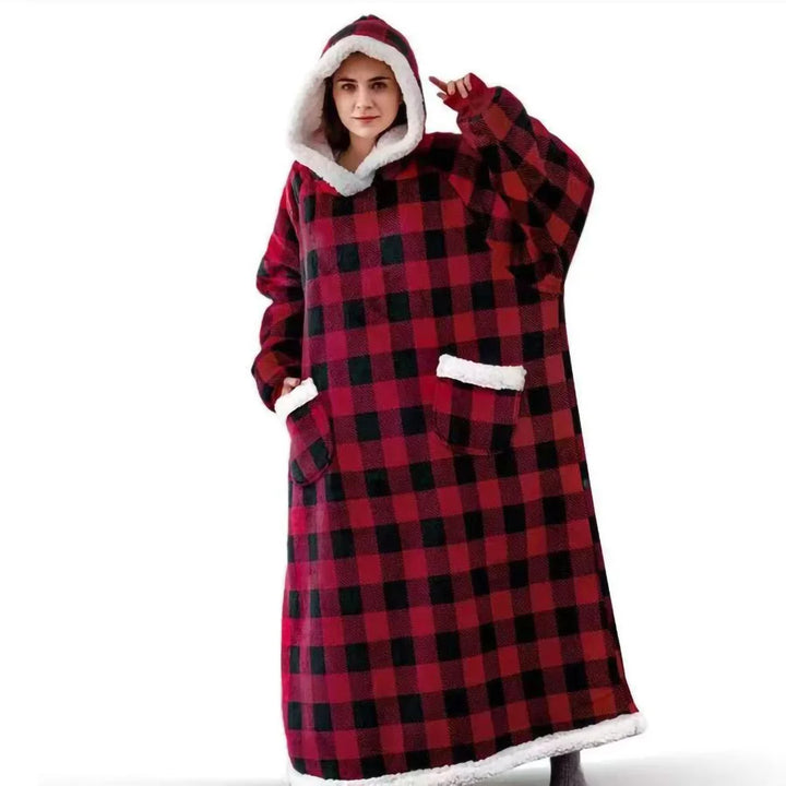Woman wearing red and black plaid hooded wearable blanket