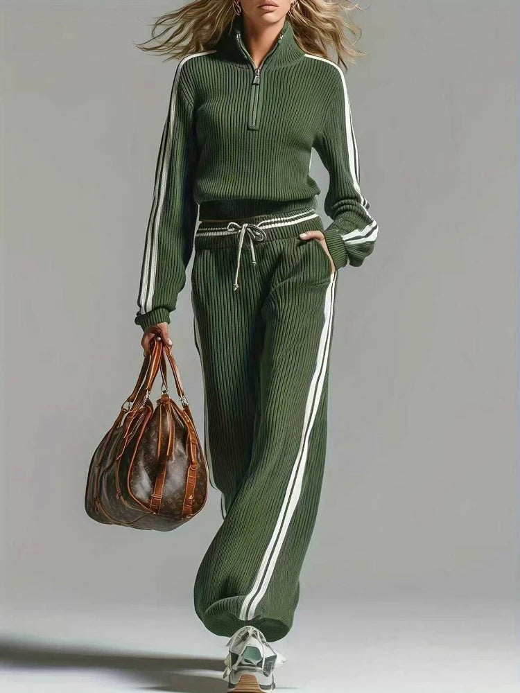Woman wearing green ribbed knit two piece set with half zip collar and wide leg pants, front view