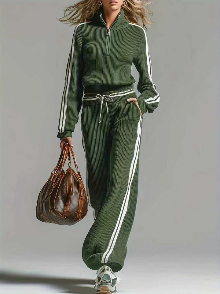 Woman wearing green ribbed knit two piece set with half zip collar and wide leg pants, front view