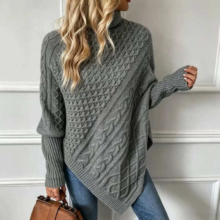 Gray cable knit poncho sweater, back view