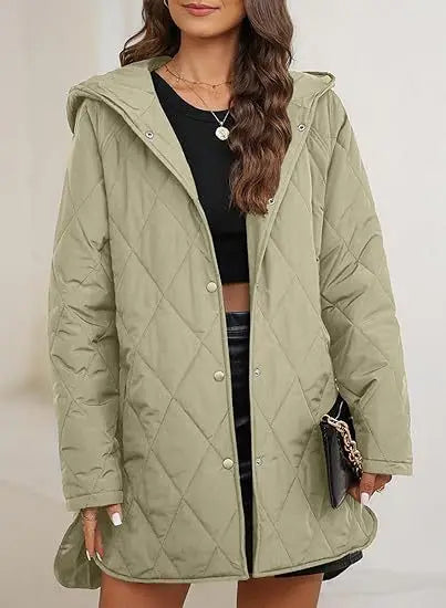 Woman wearing light green quilted hooded jacket with handbag