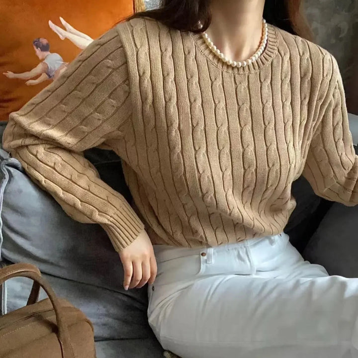 Apricot cable knit crew neck sweater on model