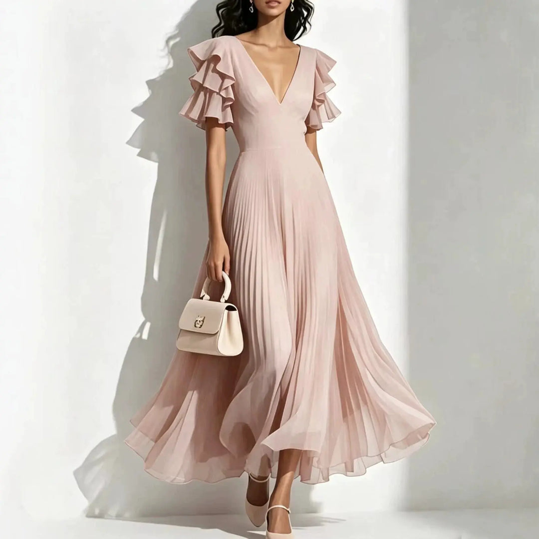 Blush pink pleated maxi dress with ruffle sleeves and deep V-neck, front view