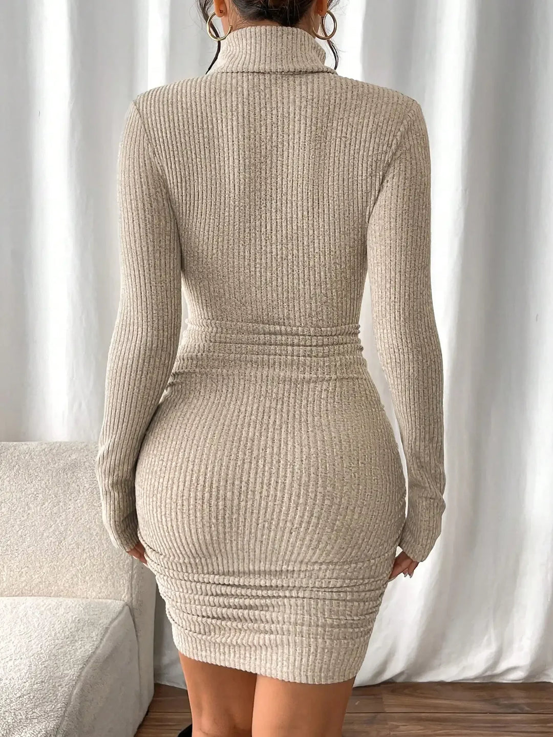 Back view of khaki ribbed knit turtleneck mini dress