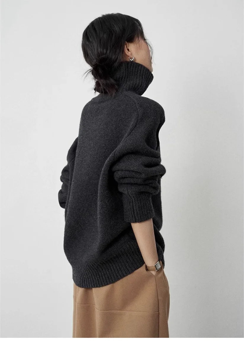Back view of black turtleneck sweater