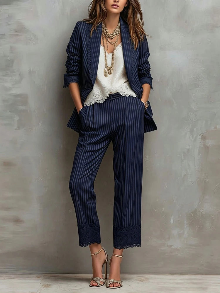 Woman wearing navy pinstripe blazer and wide-leg pants set with lace trim