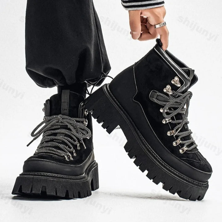 Man wearing black platform hiking boots side view