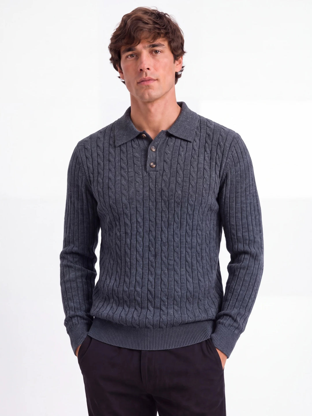 Man wearing dark grey cable knit polo sweater