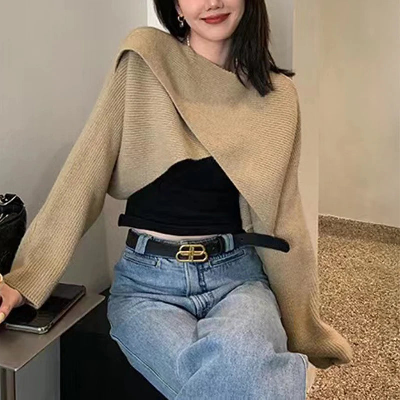 Model wearing khaki crisscross wrap crop sweater with jeans