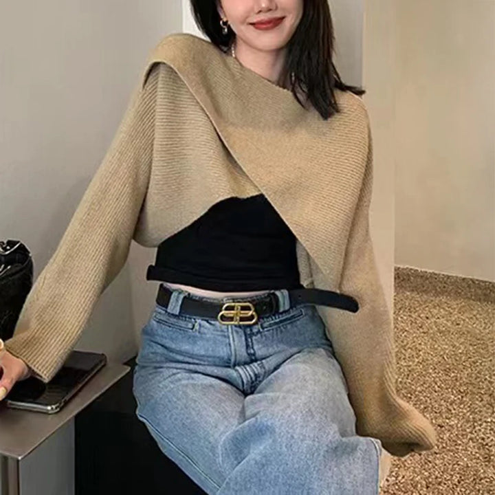 Model wearing khaki crisscross wrap crop sweater with jeans