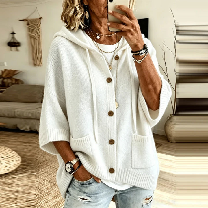 Woman wearing white hooded button-front knit cardigan