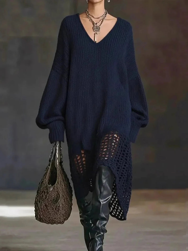 Model in navy blue oversized crochet-hem sweater dress with over-the-knee boots