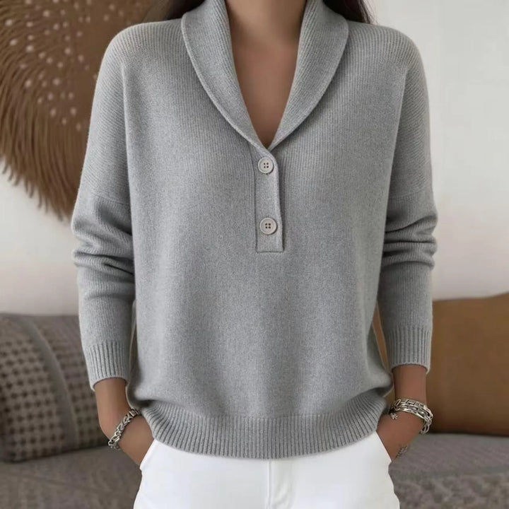 Woman wearing light gray shawl collar button sweater