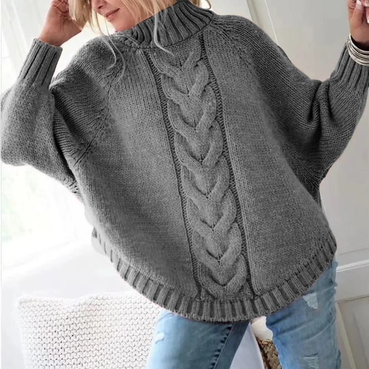 Gray cable knit sweater, back view with raised arms