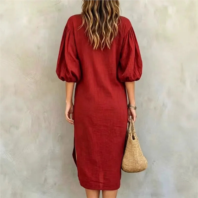 Back view of red mock neck midi dress with balloon sleeves