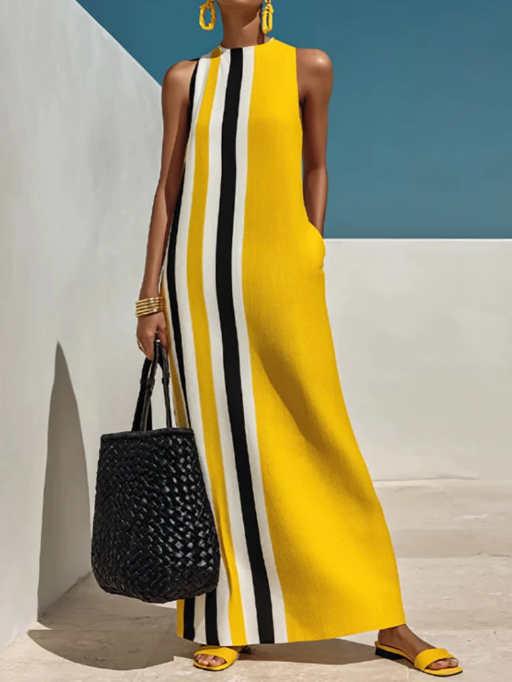 Woman wearing yellow striped sleeveless maxi dress, front view