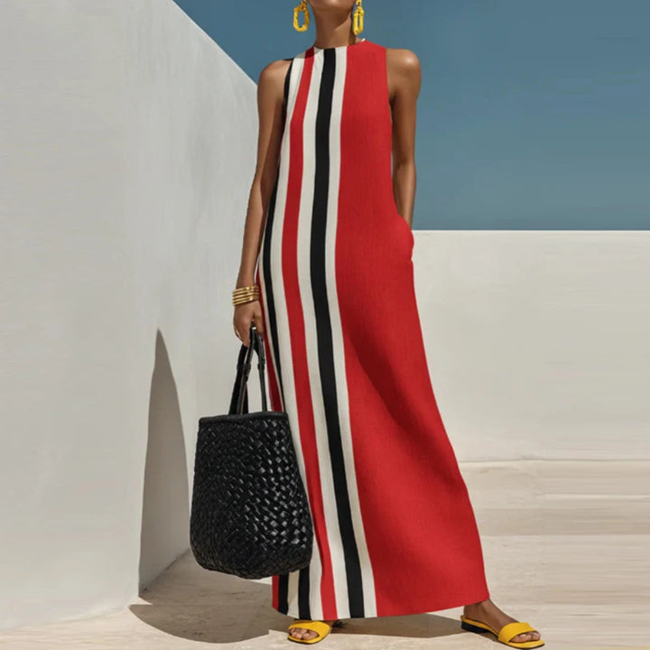 Woman wearing red striped maxi dress with woven tote bag