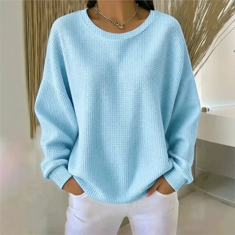 Woman wearing light blue waffle knit oversized top