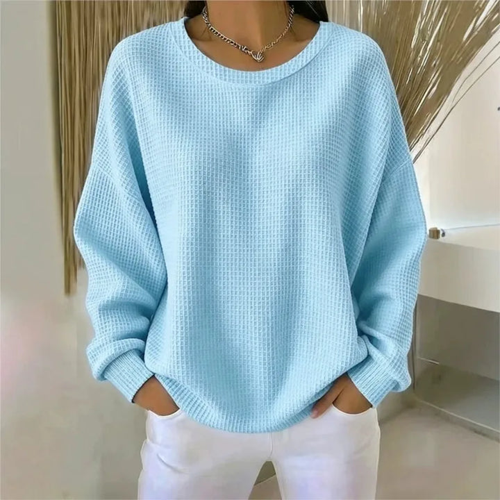 Woman wearing light blue waffle knit oversized top