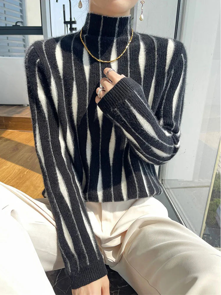 Black and white striped mock neck sweater on model