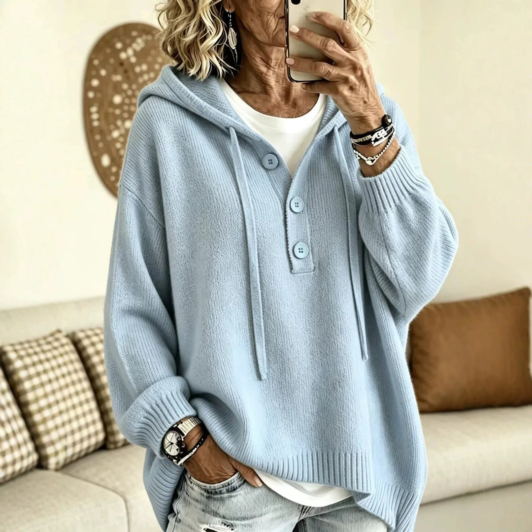 Woman wearing sky blue ribbed knit hoodie with button placket