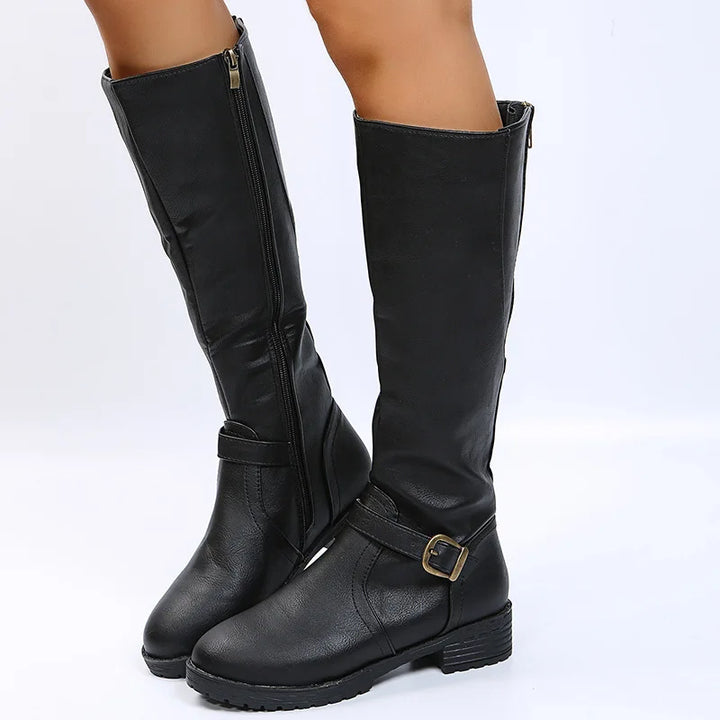 Black knee-high boots with side zip and buckle strap