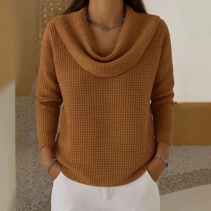 Woman wearing camel waffle knit cowl neck top