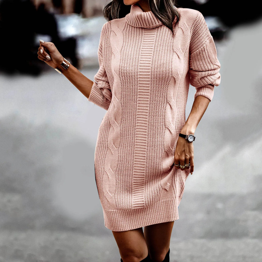Woman walking in pink cable knit turtleneck sweater dress