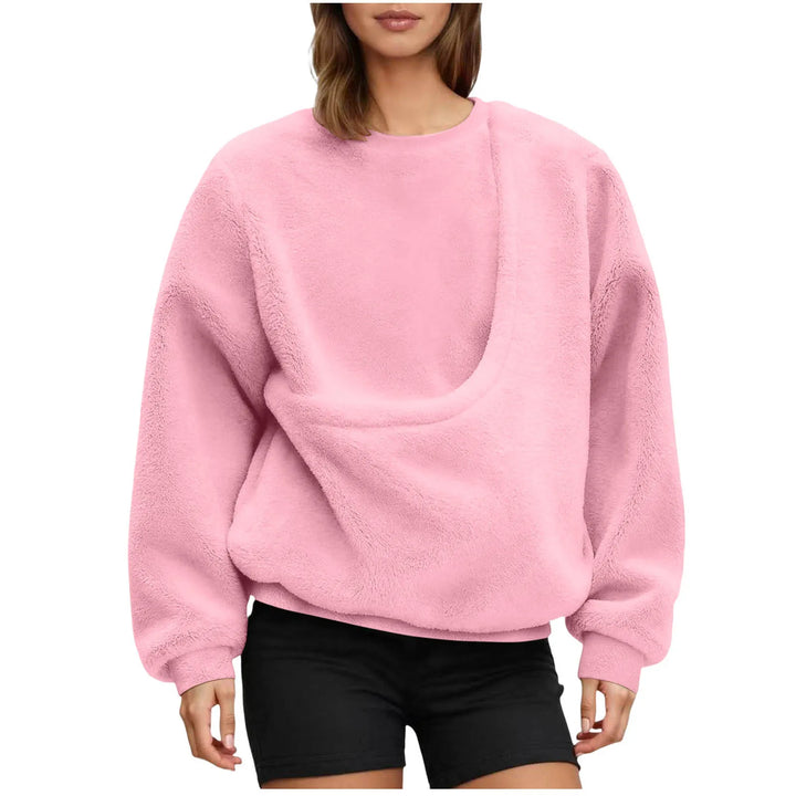 Woman wearing pink fleece pullover with angled front pocket