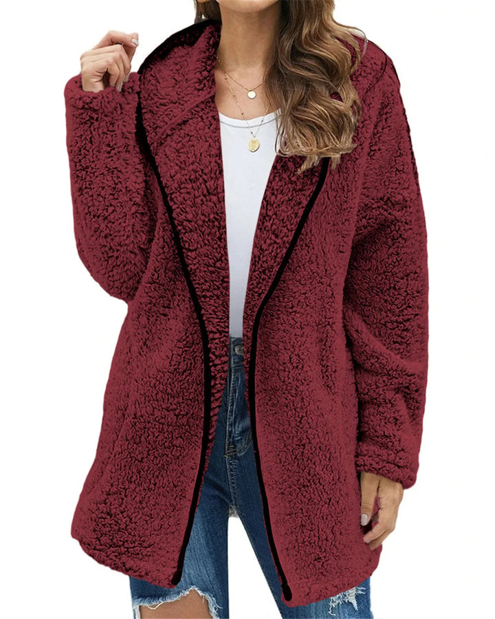 Woman wearing burgundy brushed sherpa hooded jacket with black trim
