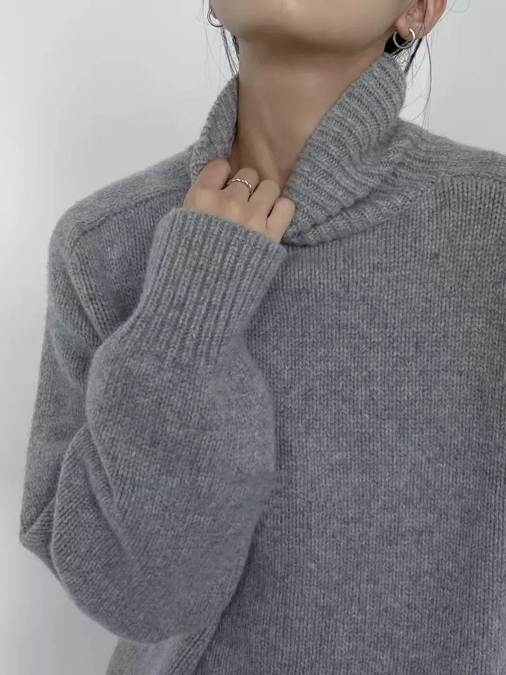 Close up detail of light gray ribbed turtleneck collar