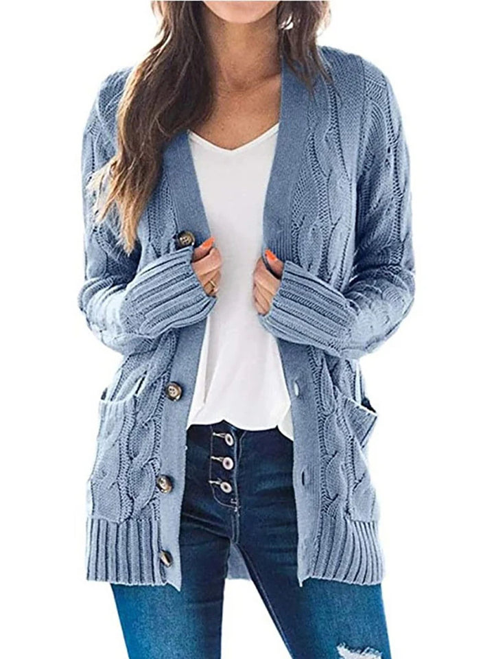 Woman wearing light blue cable knit cardigan