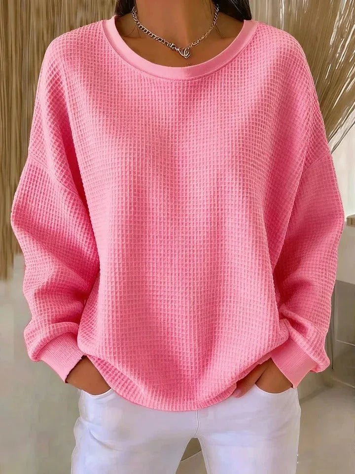 Woman wearing rose red waffle knit oversized top
