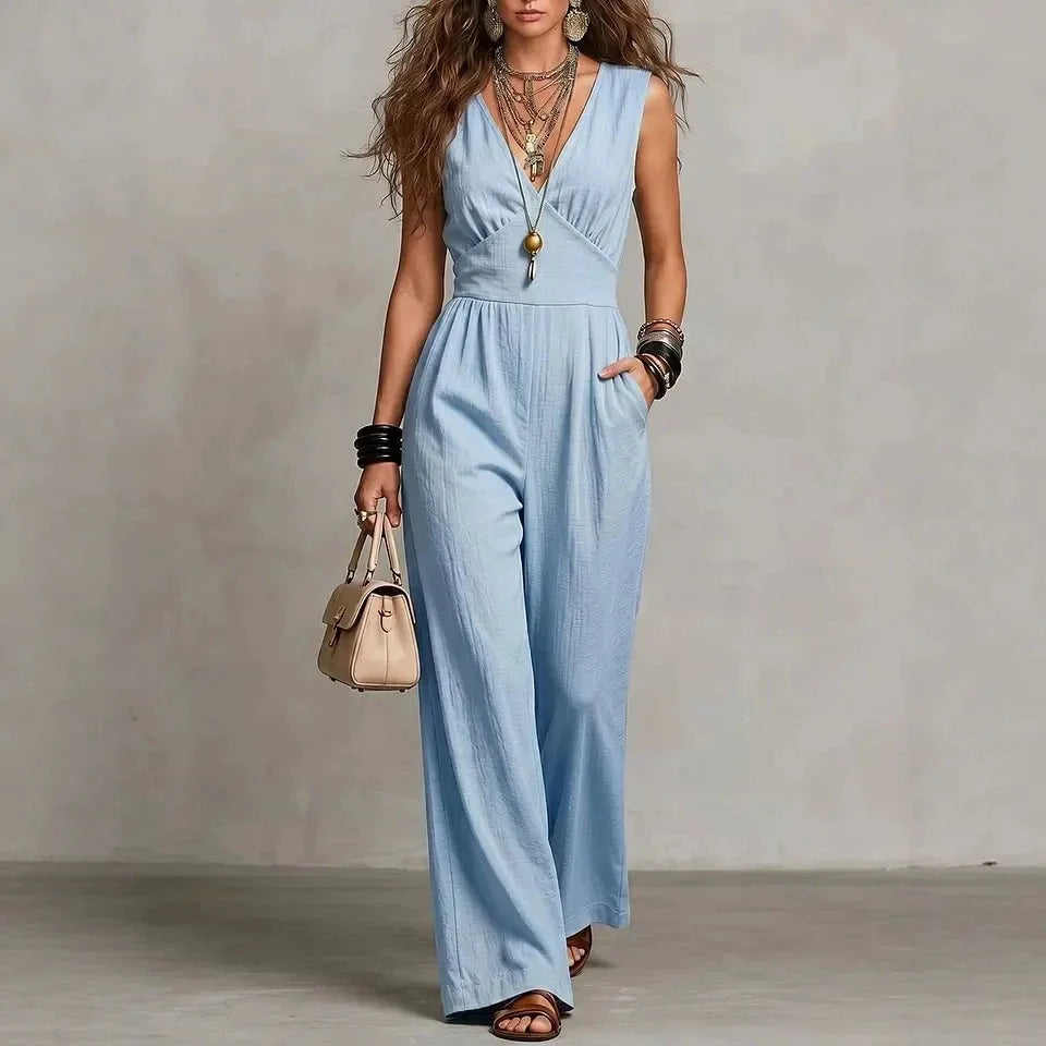 Woman wearing light blue wide leg jumpsuit with empire waist
