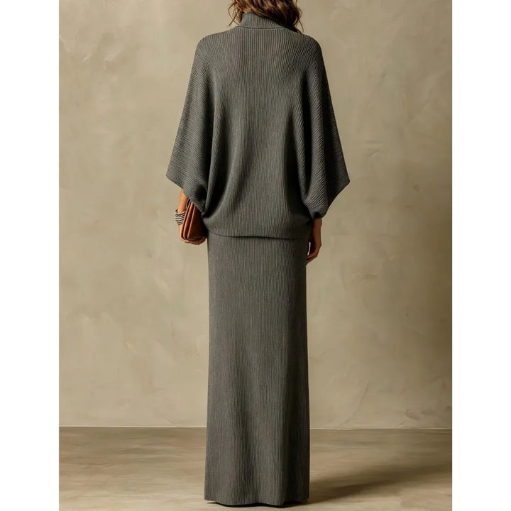Back view of gray ribbed knit two piece skirt set with batwing sleeves
