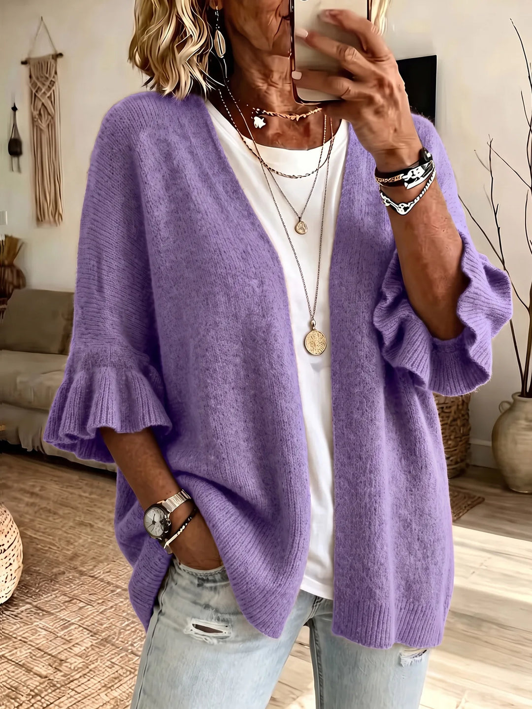 Purple knit cardigan with ruffle sleeves, front view