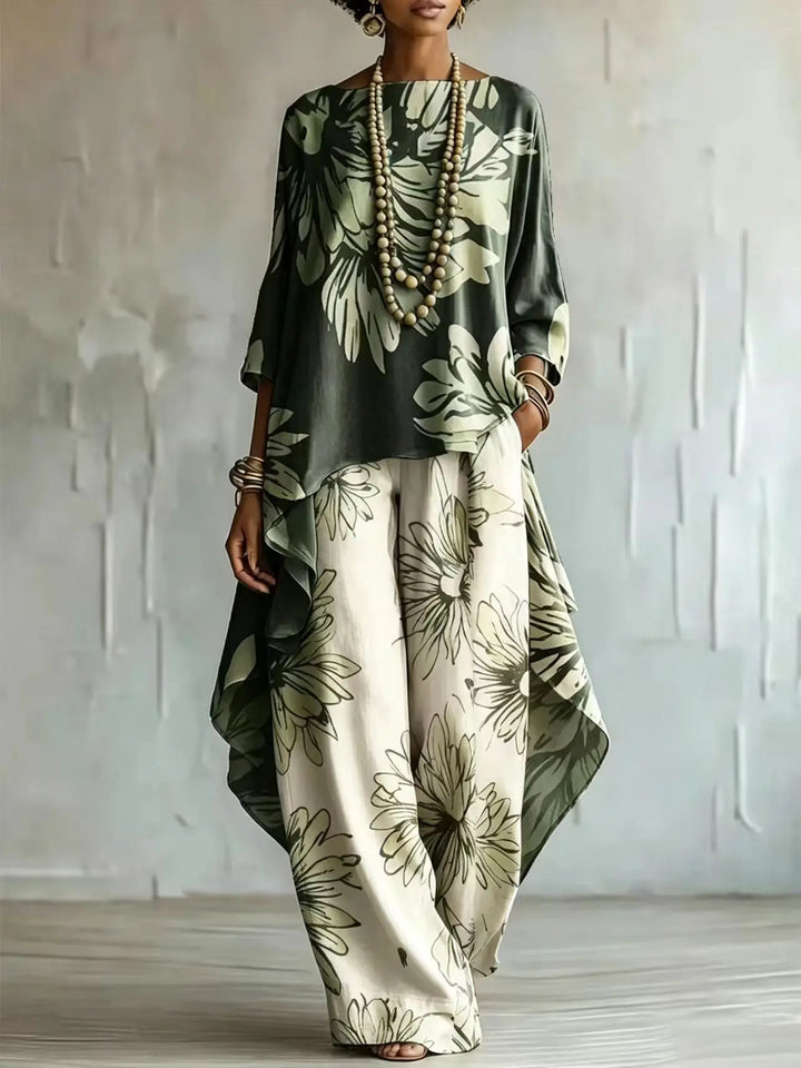 Woman wearing dark green floral two-piece set with asymmetric top and wide leg pants