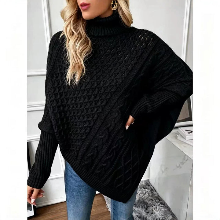 Black cable knit poncho sweater, front view